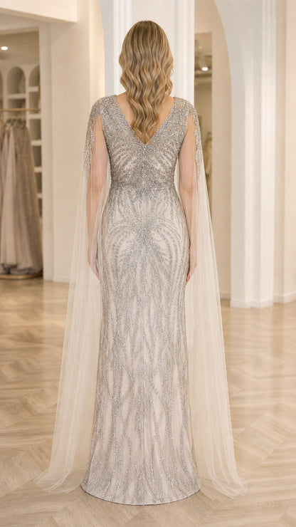 Back view of Champagne Silver sequin evening gown showing V-back design and tulle cape