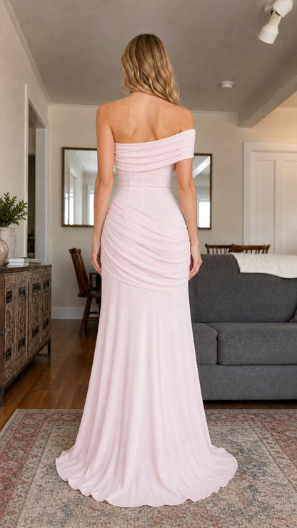 Back view of the blush pink gown displaying the draped back neckline