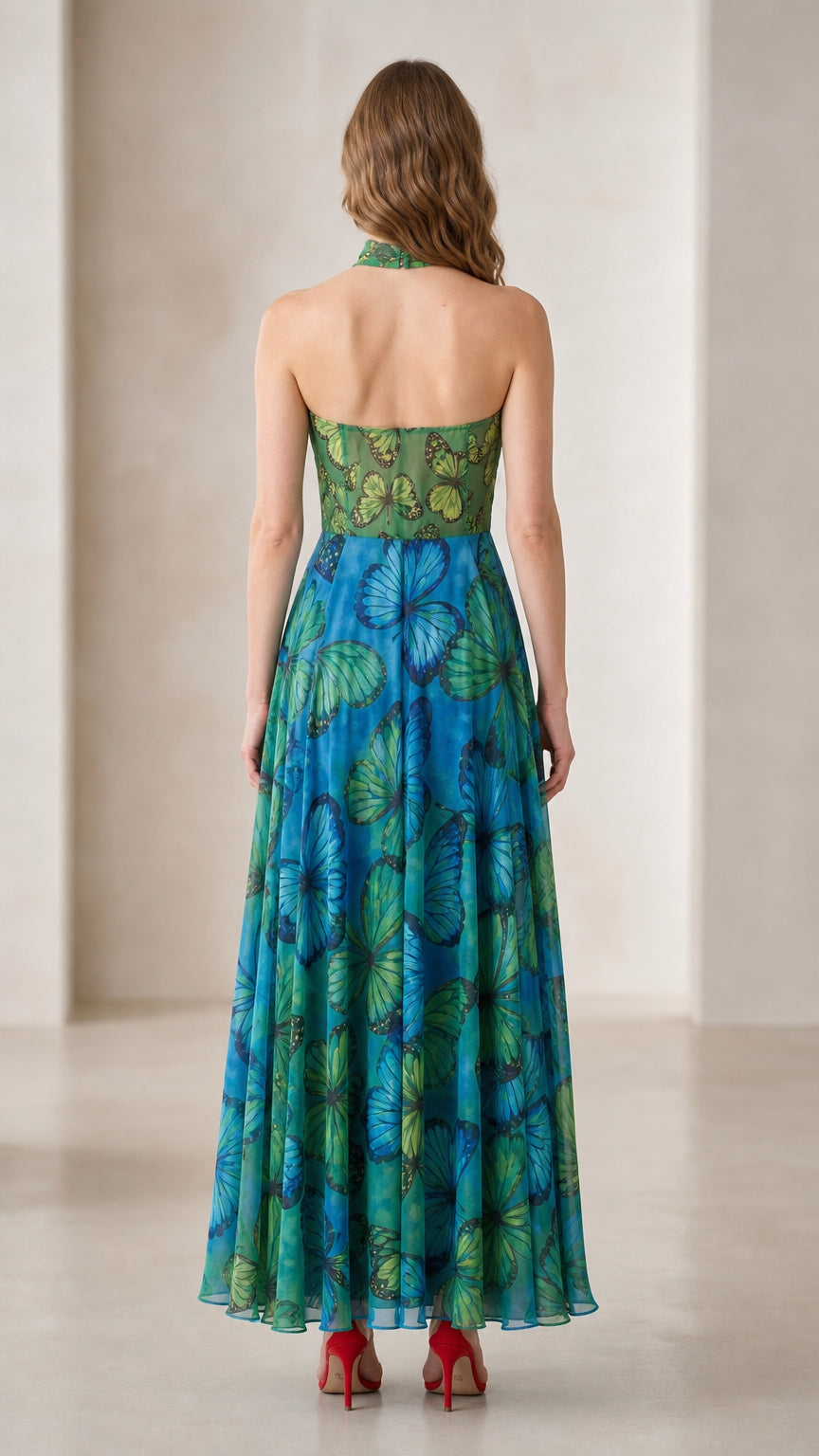 Back view of woman showing open back and halter cut of butterfly maxi dress