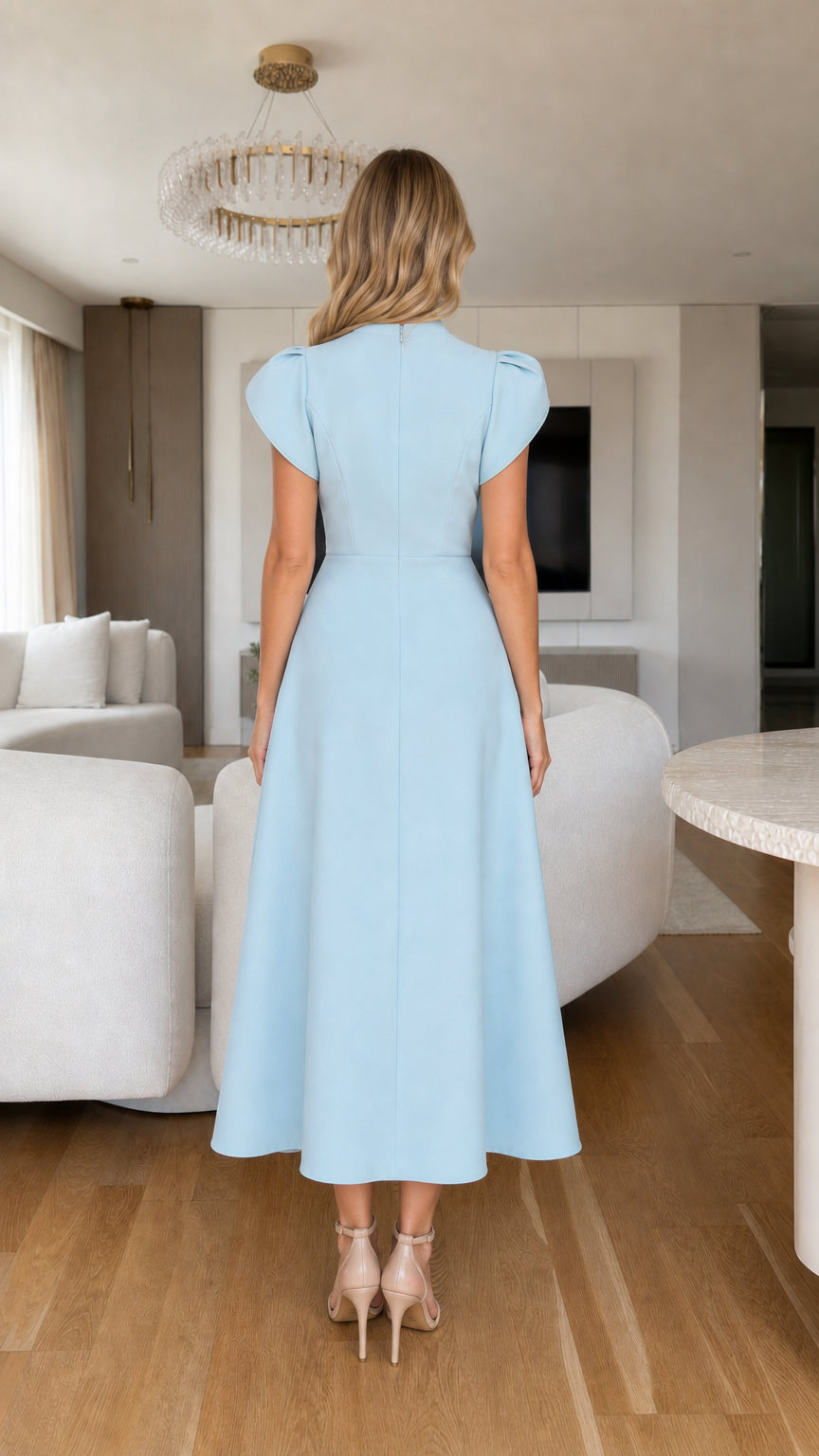Back view of model in light blue tailored A-line midi dress