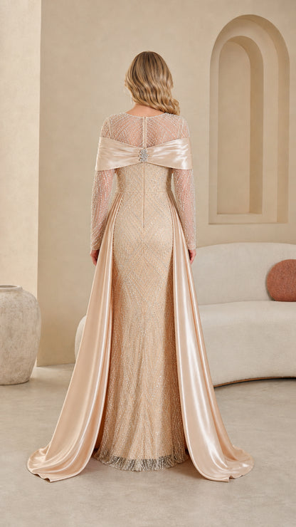 Back view of champagne sequin evening dress with flowing satin cape train
