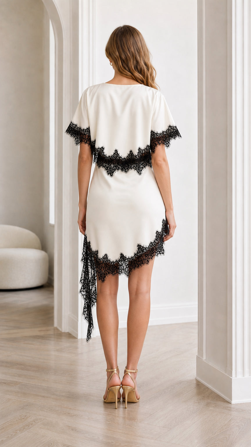 Back view of white dress showing lace overlay details