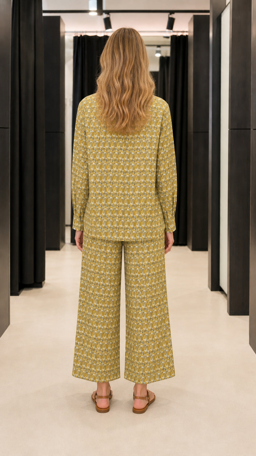 Back view of woman wearing olive two-piece pants set