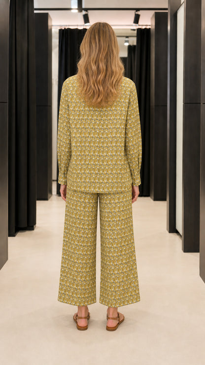 Back view of woman wearing olive two-piece pants set