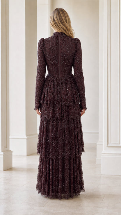 Back view of model in high neck long sleeve burgundy embellished maxi dress