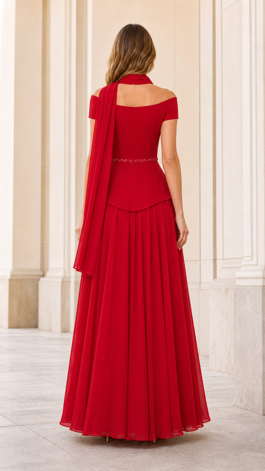 Back view of red evening gown showing flowing chiffon skirt