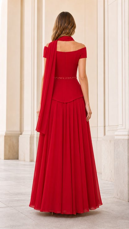 Back view of red evening gown showing flowing chiffon skirt