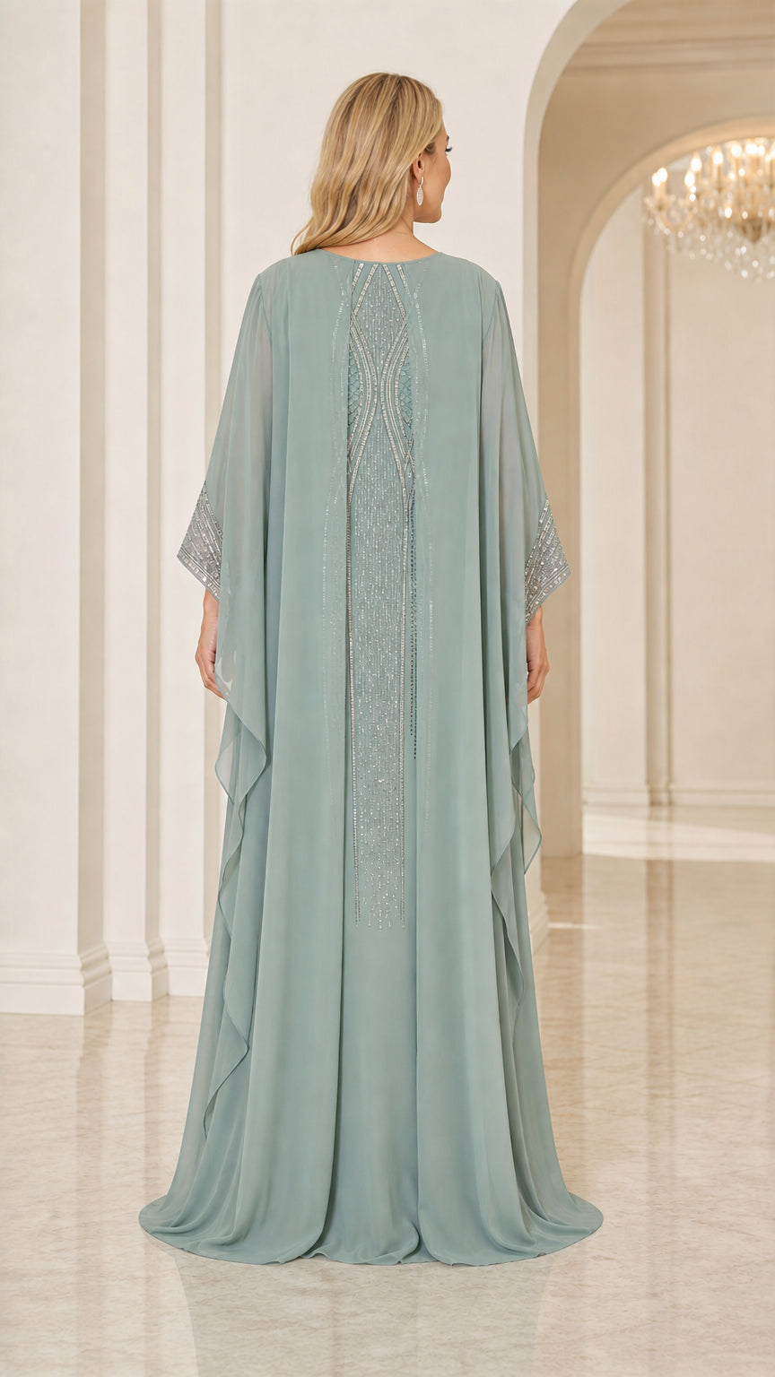 Back view of sage green cape maxi dress with beaded back accent