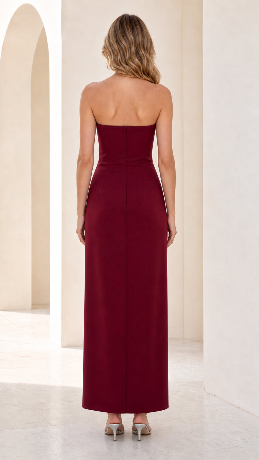 Back view of burgundy strapless formal gown