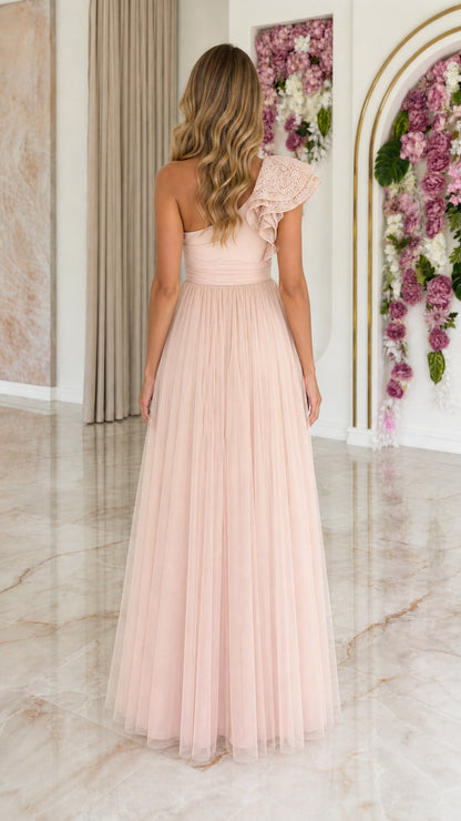 Back view of blush pink one-shoulder tulle floor-length gown