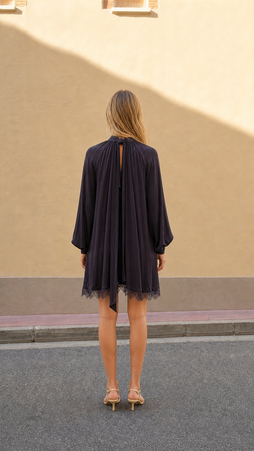 Plum relaxed A-line mini dress shown from the back