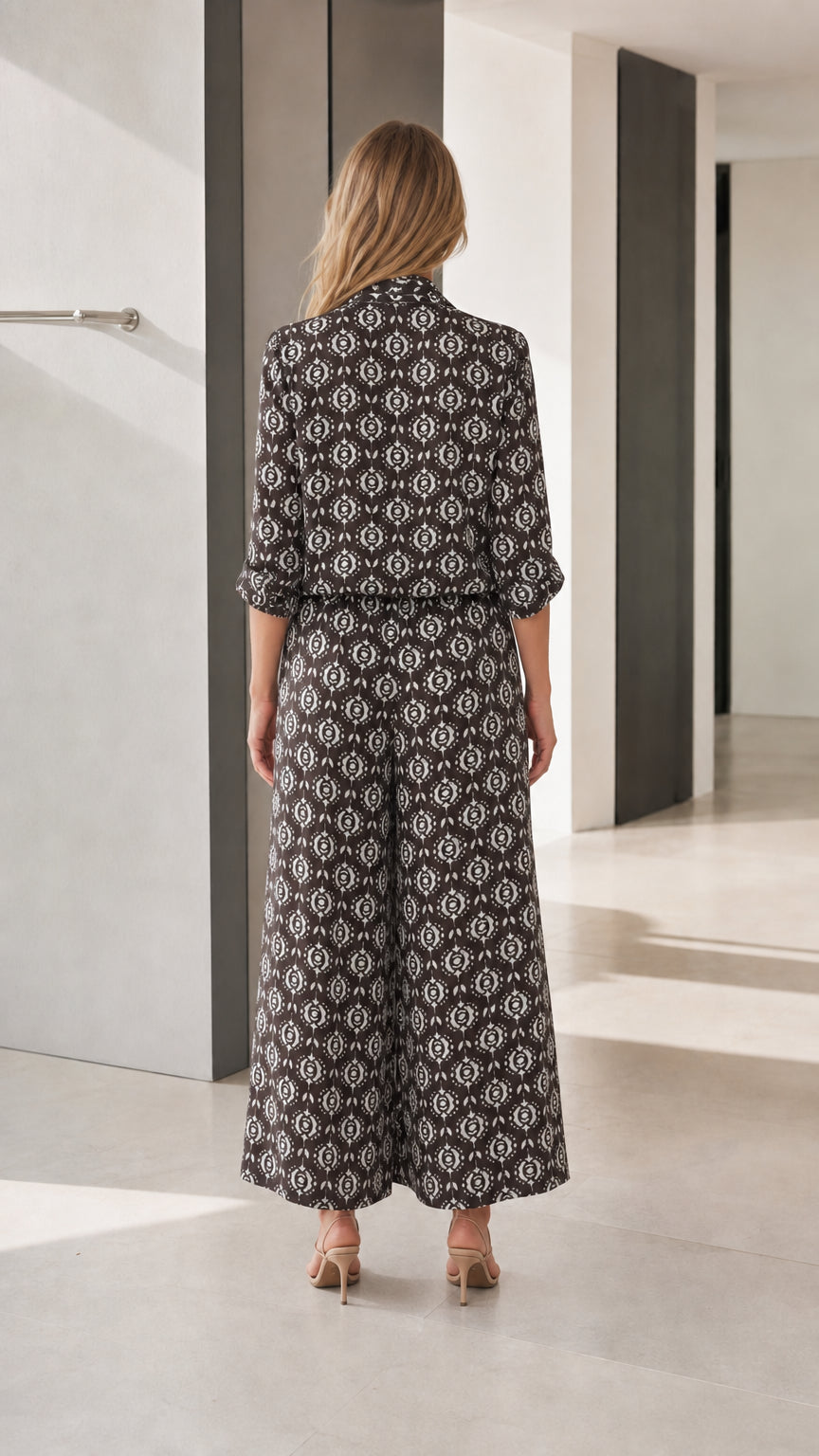 Back view of black printed wide-leg jumpsuit