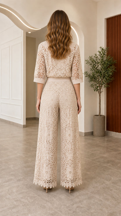 Back view of woman wearing beige lace shirt and wide-leg pants outfit