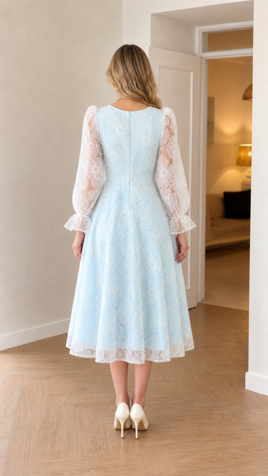 Back view of baby blue A-line midi dress with long sheer sleeves