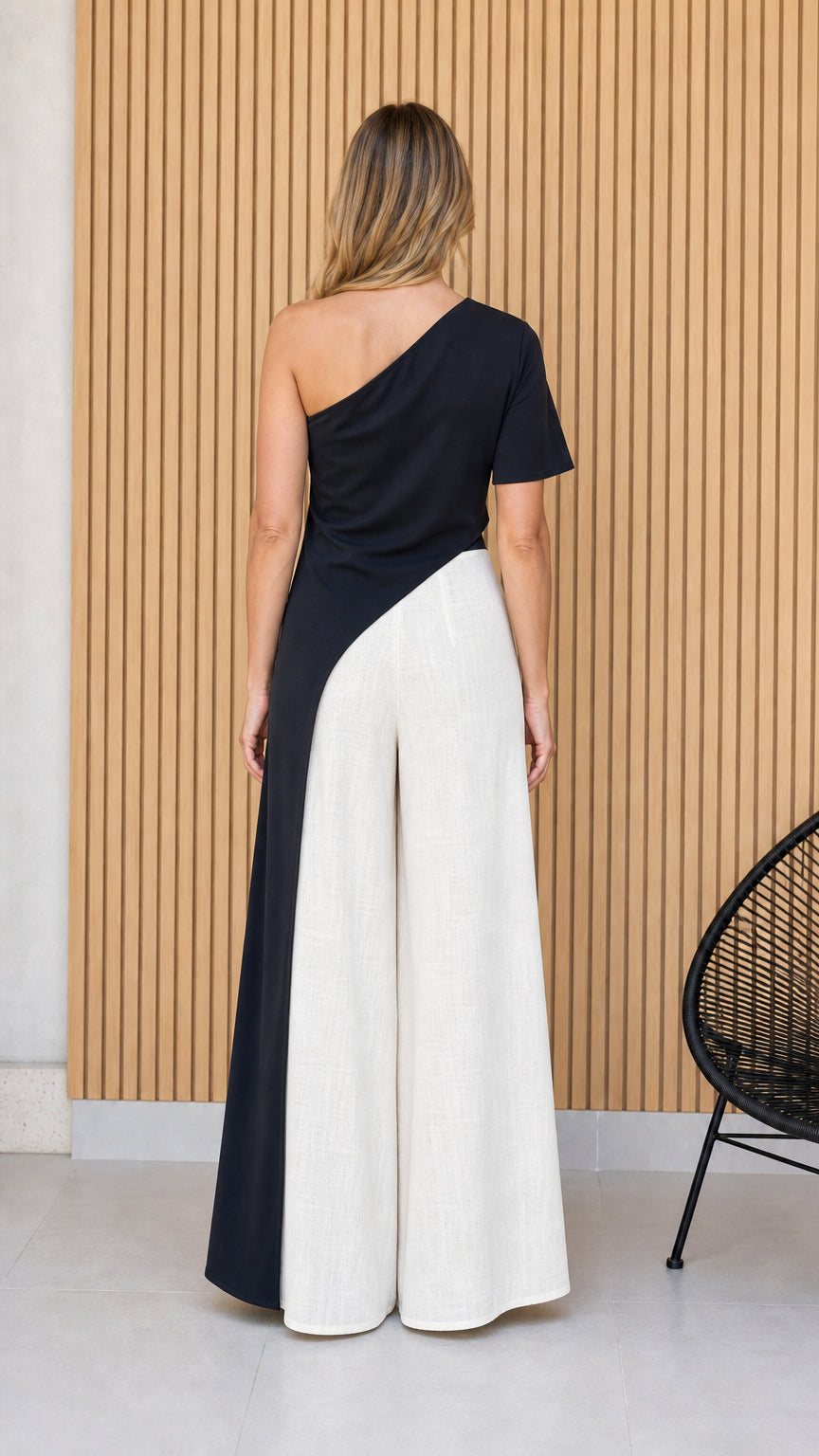 Back view of black and white colorblock jumpsuit