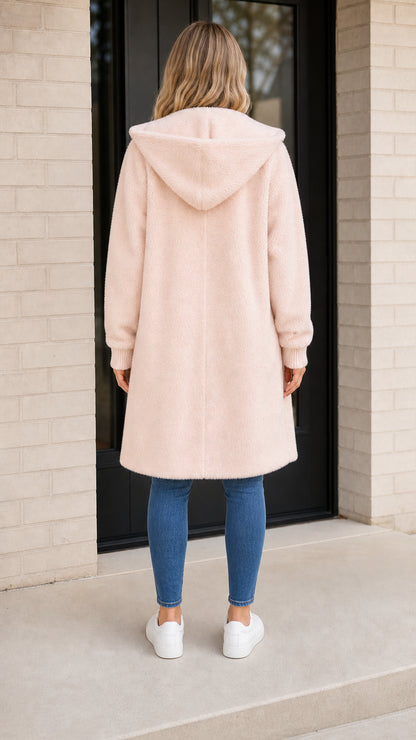 Back view of light pink hooded shearling coat