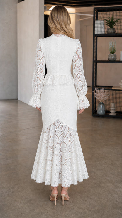 Back view of model showing detailed lace pattern and mermaid hem in white