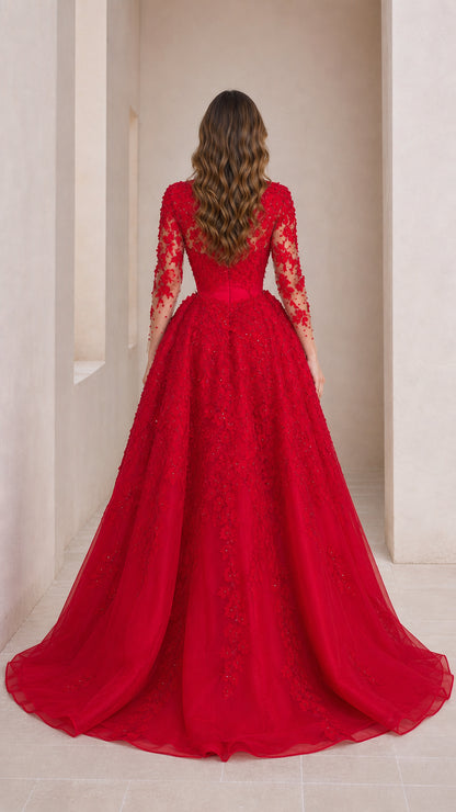 Back view of red evening dress showing detailed overskirt and train