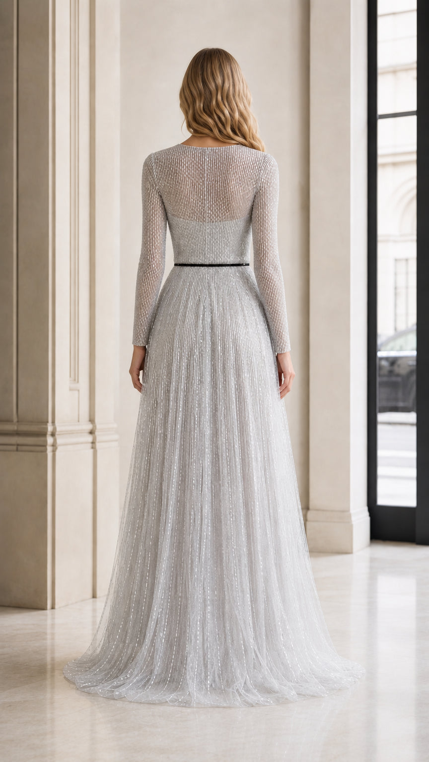 Back view of silver sequin evening gown showing floor-length skirt