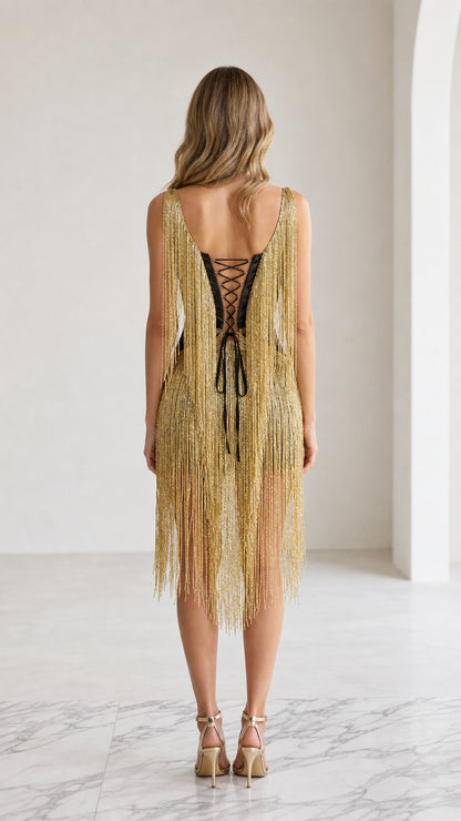 Back view of the gold fringe dress with lace-up details