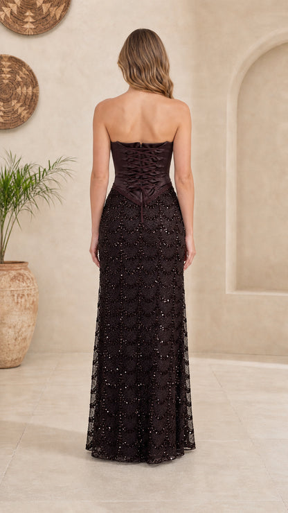Back view showing lace-up details of dark brown gown