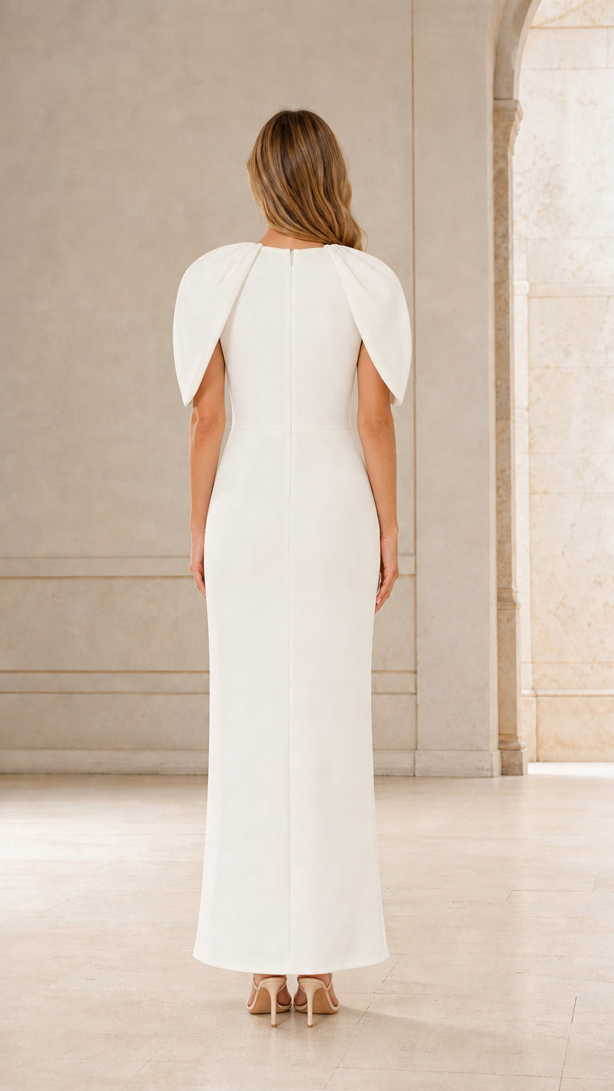 Back view of woman wearing white evening gown