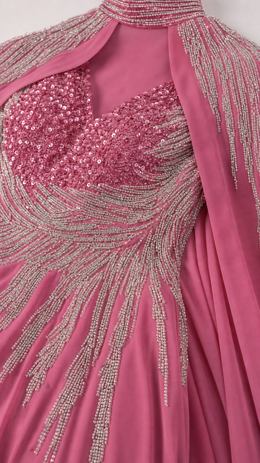 Close up detail of sparkling sequin and bead embellishment on pink bodice