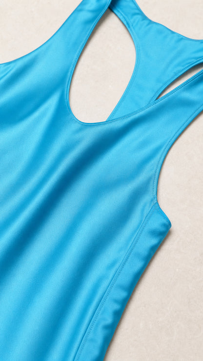 Close-up detail of smooth sky blue satin fabric and neckline seam