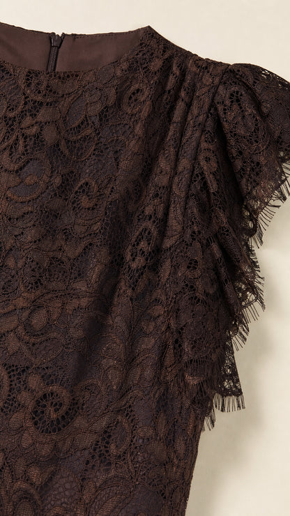 Close-up detail of dark brown lace and ruffle shoulder
