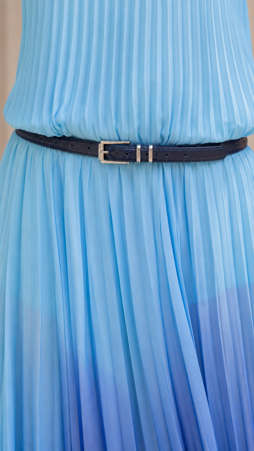Close up of pleated texture and skinny belt on blue ombre dress