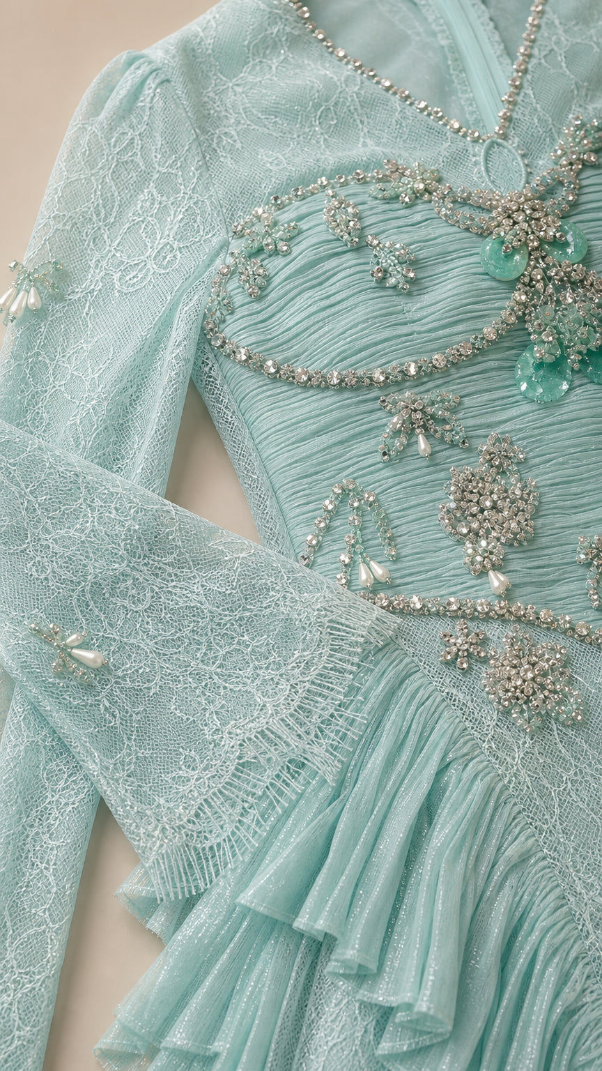 Close-up of sparkling crystal beading and floral lace bodice