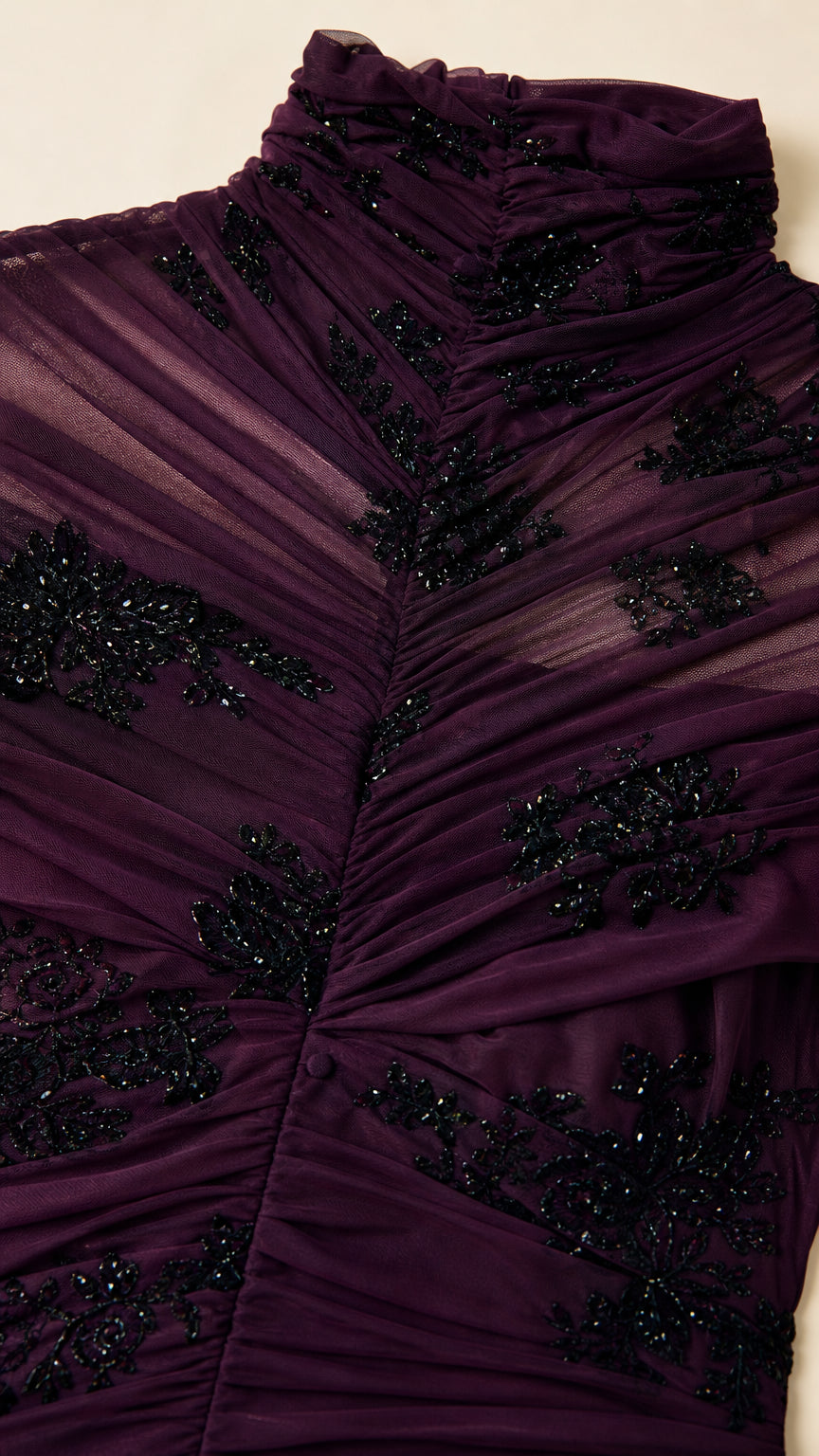 Close-up of mock neck and beaded embroidery detail