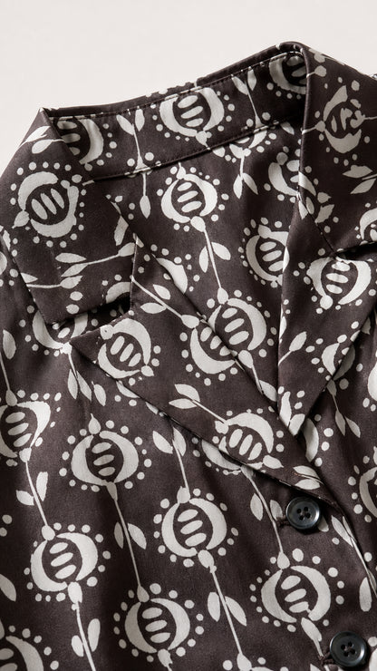 Close-up detail of collar and botanical print