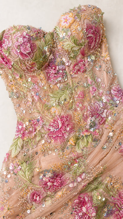 Close-up detail of 3D floral embroidery and sequin embellishments on bodice