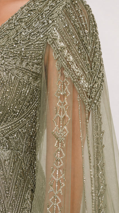 Close-up detail of intricate beading and sequin embroidery on mesh cape sleeve