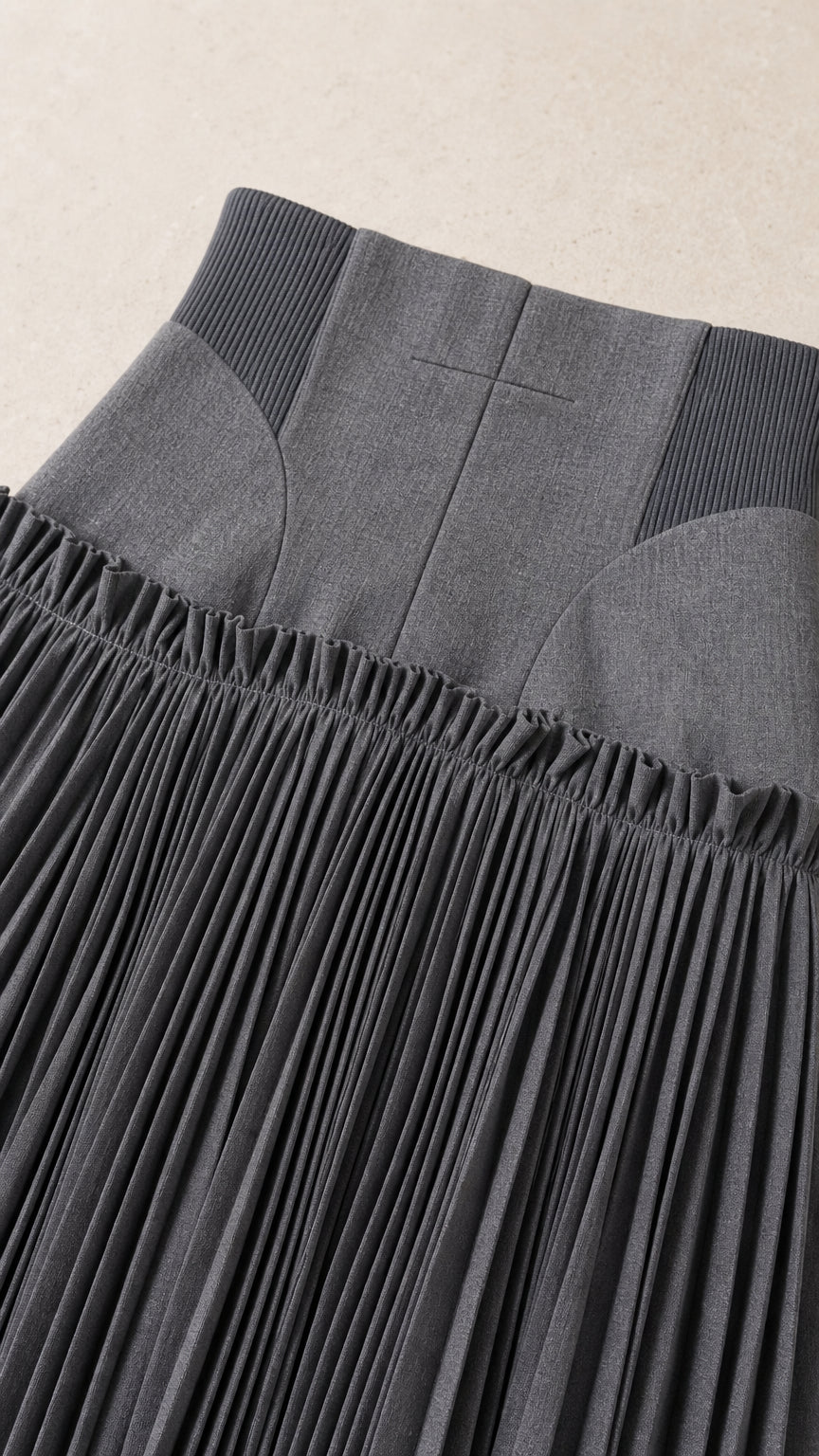 Close-up of the structured waistband and pleats