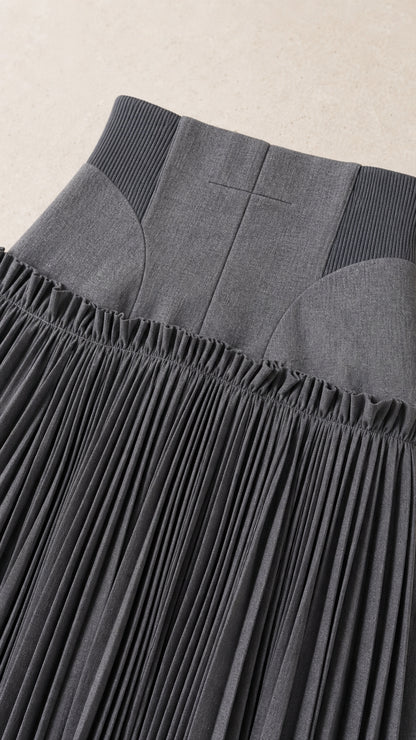 Close-up of the structured waistband and pleats