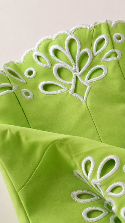 Close-up of lime green dress embroidery detail