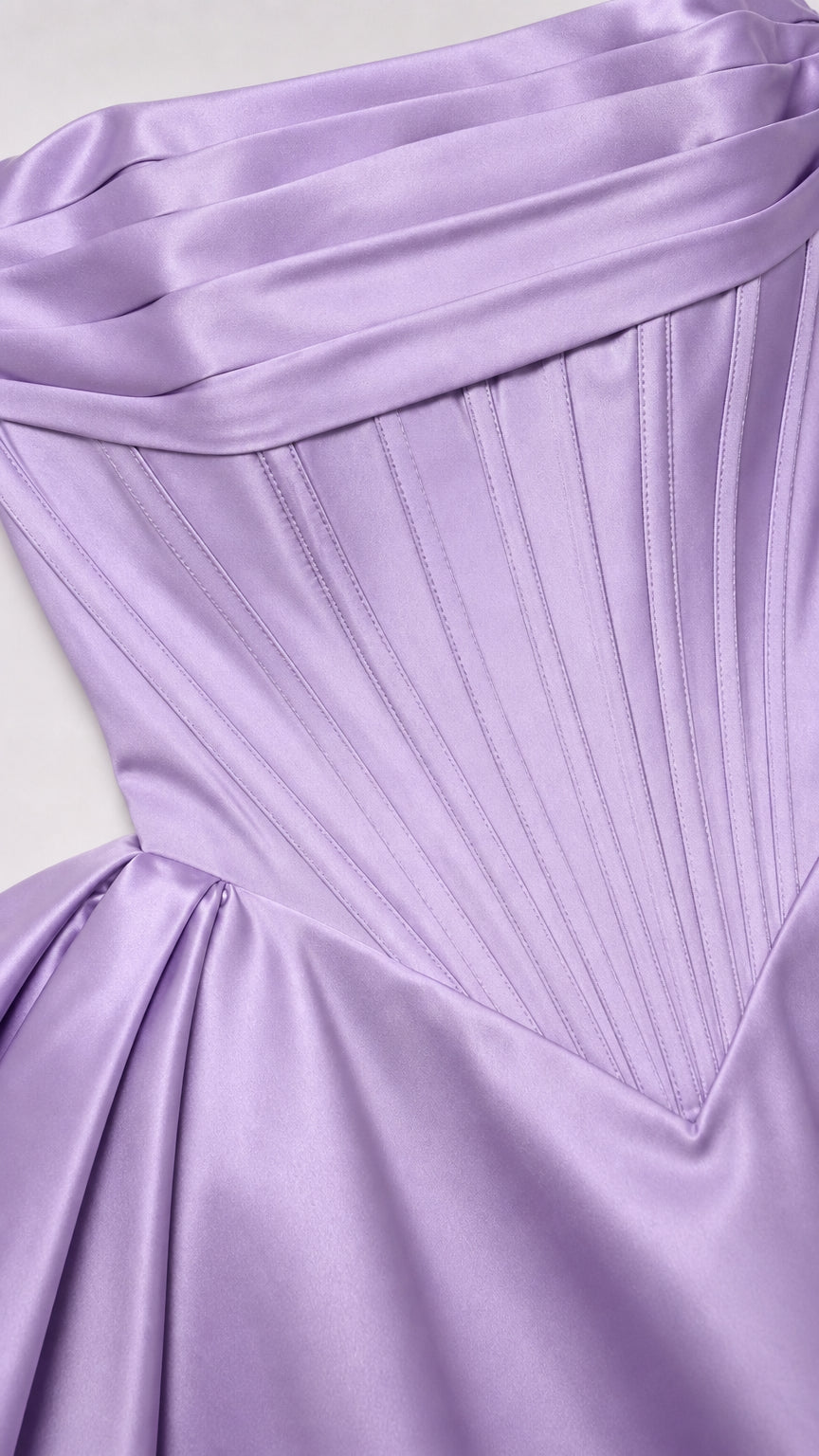 Close-up of structured boning and satin pleats on corset bodice