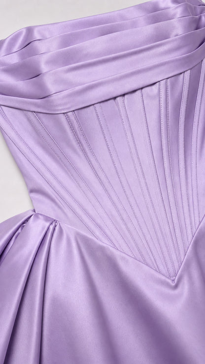 Close-up of structured boning and satin pleats on corset bodice