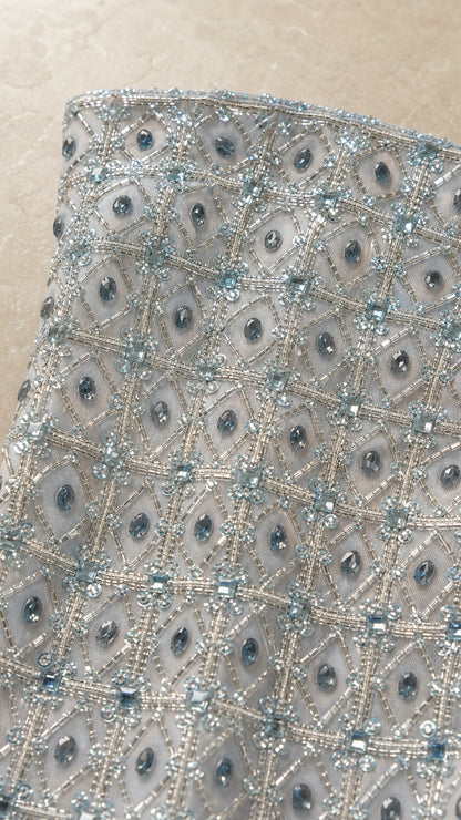 Close-up detail of geometric bead and sequin embellishments