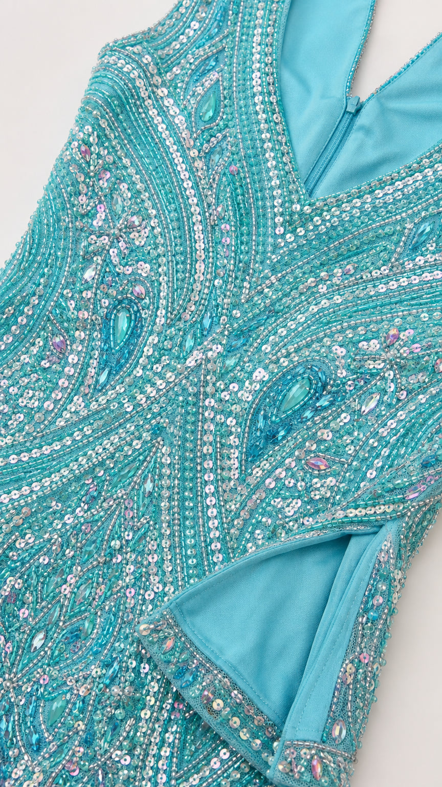 Close-up detail of intricate beadwork, sequins, and fabric texture