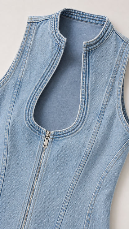 Close-up detail of neckline and zipper on denim dress