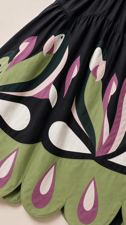 Close-up detail of the contrast floral motif and scalloped hem