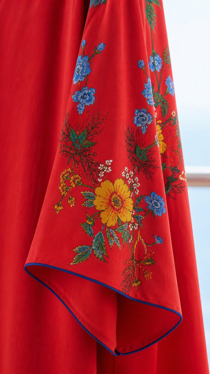 Close up of embroidered sleeve detail on red kaftan