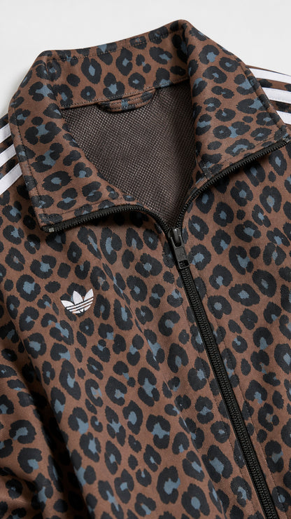 Close-up of brown leopard print fabric, collar, and zipper detail