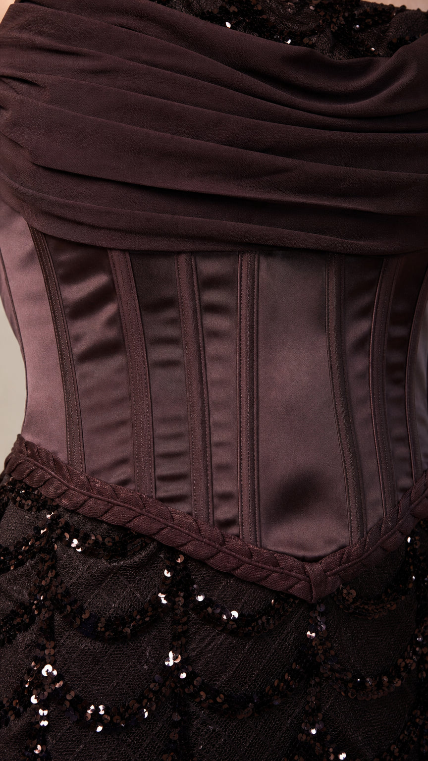 Close-up of structured satin corset bodice and sequin skirt