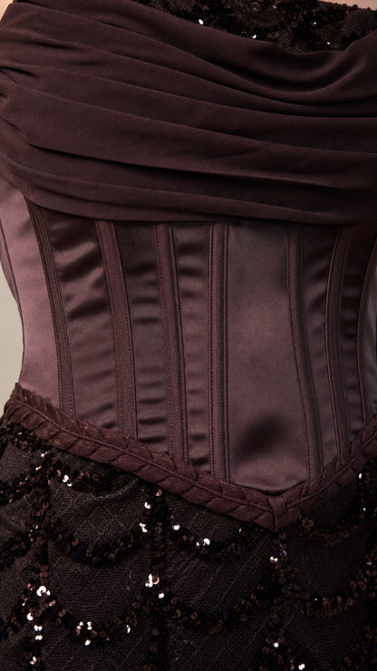 Close-up of structured satin corset bodice and sequin skirt