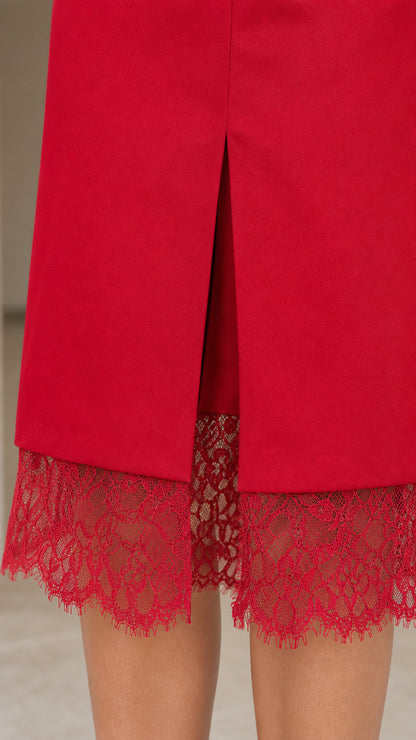 Close-up detail of center front slit and red floral eyelash lace trim hem