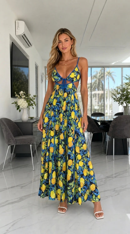 Model wearing navy background lemon print cutout maxi dress